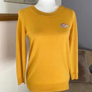 Merino wool crewneck sweater with turtle decorative embroidery